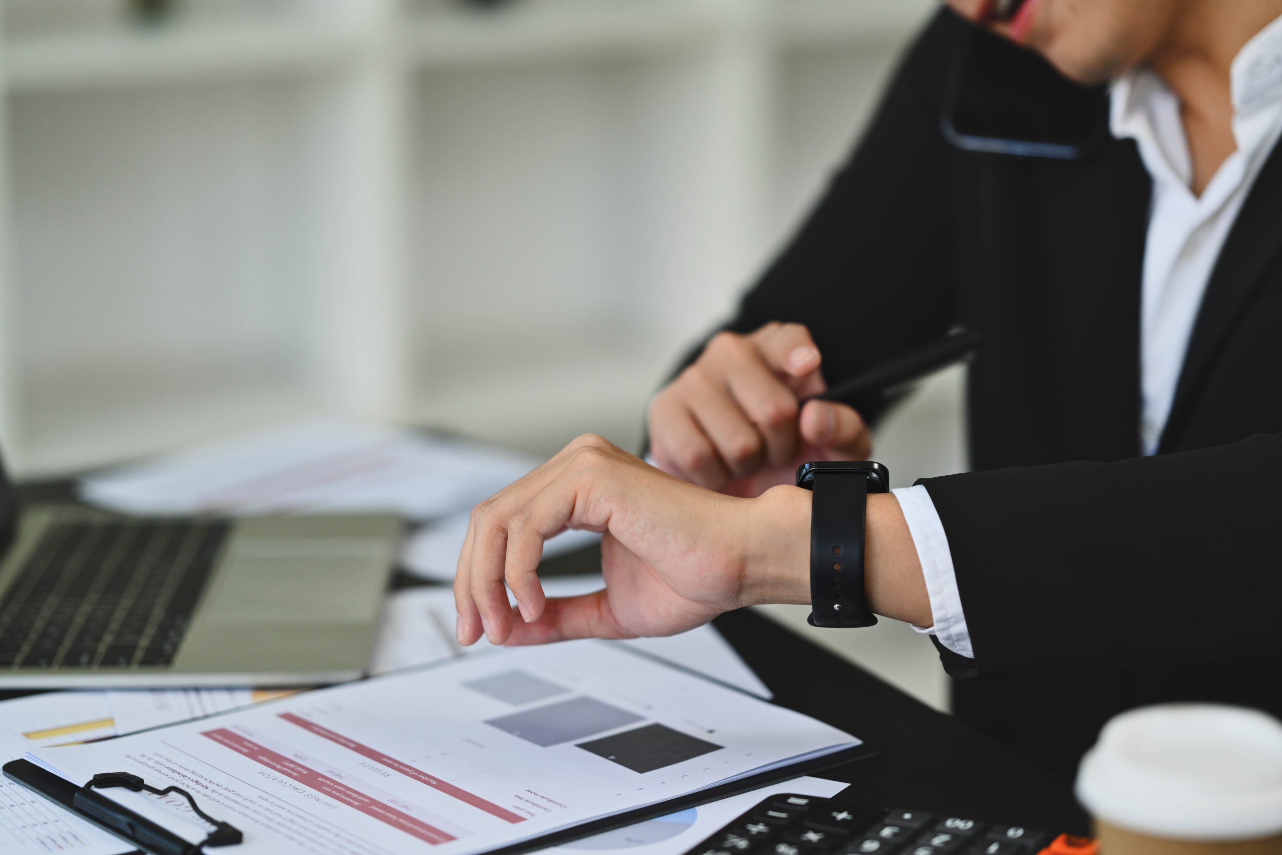 Time Management for Focus and Impact cropped shot of young businessman in formal suit checking time on wrist watch for appointment